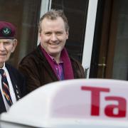 Taxi driver Colin Dobson taking Sam Langford to Oxford Town Hall to collect his D-Day medal