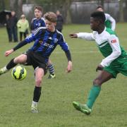 Toby Pattison shows neat control for Harwell & Hendred Under 15s, while under pressure from Oxford Irish’s Noah Alabi