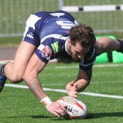 HAT-TRICK HERO: Jordan Gill produces a spectacular dive as he scores one of his three tries that secured Oxford RL a thrilling victory over York City Knights