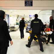 Paramedics bring a patient into A&E at the John Radcliffe Hospital. Picture: Jon Lewis