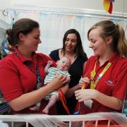 Children's Hospital play specialists Emily Hodgekinson, left, and, Klarissa Burrows with seven-month-old Billy Kearns and his mum Laura..DATE: 26.05.2017..Pic by Jon Lewis......