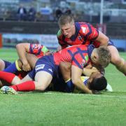 HARD WORK: Oxford RL do all they can to stop Doncaster in their tracks during a 34-16 defeat in Kingstone Press League One Picture: Simon Hall