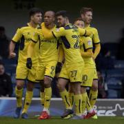 Wes Thomas (No 9) is congratulated after equalising for Oxford United  Picture: David Fleming