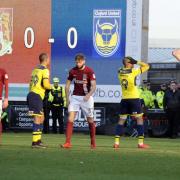 Wes Thomas (No 9) reacts to his late header hitting the post at Northampton Town  Picture: David Fleming