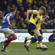 Rob Dickie (right) was pushed over for Oxford United's penalty  Picture: David Fleming