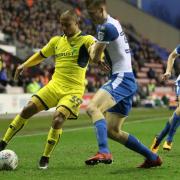 Gino van Kessel holds off a challenge against Wigan Athletic  Picture: Richard Parkes