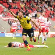 James Henry celebrates scoring Oxford United's winner at Doncaster Rovers  Picture: James Williamson