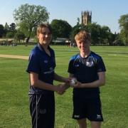 James Coles (5-18) ( left) receiving the match ball from Oxfordshire Boys U15 Captain Freddie Smith (156*)after their match winning contributions at Magdalen College School v Isle of Wight U15s