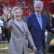 Democratic presidential candidate Hillary Clinton, and her husband former President Bill Clinton, greet supporters after voting in Chappaqua, N.Y., Tuesday, Nov. 8, 2016. (AP Photo/Seth Wenig).