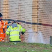 The graffiti being cleaned off at the weekend. Pic: SWNS