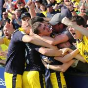 Gavin Whyte celebrates his hat-trick with the Oxford United fans at Shrewsbury Picture: Richard Parkes