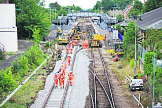 Connecting up the new double track at Moreton-in-Marsh station, in Gloucestershire, on August 6, 2011. The remains of the old single-to-double track point at the end of the section from Evesham, in Worcestershire, are still in place on the right
