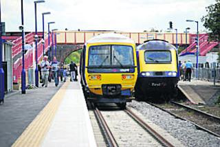 Trains passing on newly-opened double track at Honeybourne station in Worcestershire on August 22, 2011, the first time this was possible since the singling of much of the Cotswold Line in 1971