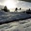 A man shovels snow from the footpaths in Hutton-Le-Hole, North Yorkshire as Britain's big freeze shows little sign of relenting