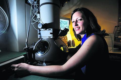 Dr Megan Dowie with the electron microscope