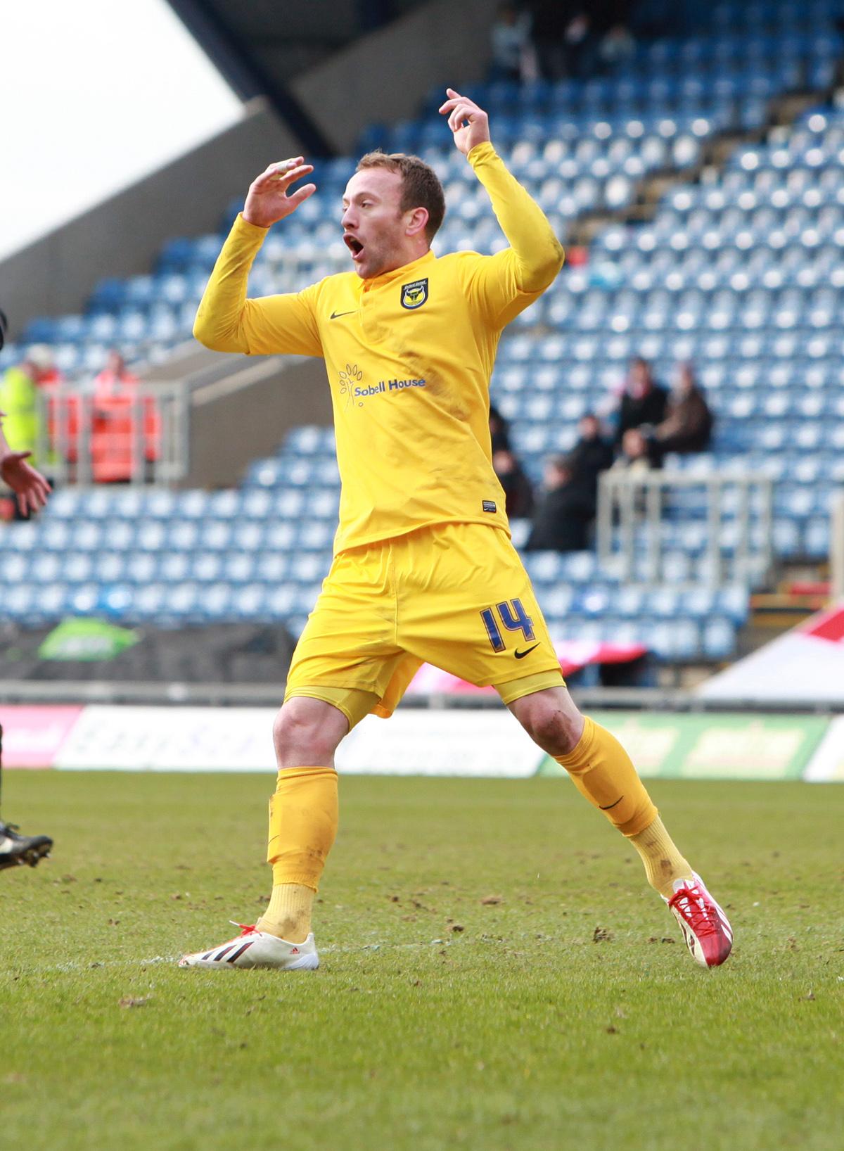 Oxford United were hit by a body-blow as Morecambe scored with just seconds remaining to claim a share of the points. 