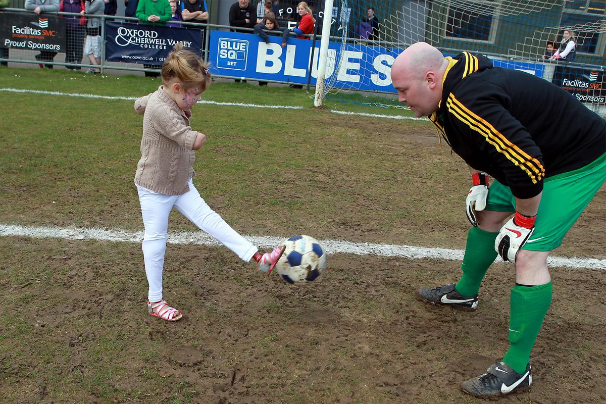 Little Charlotte Nott was joined by football legends to kick off a star-studded charity football match. 