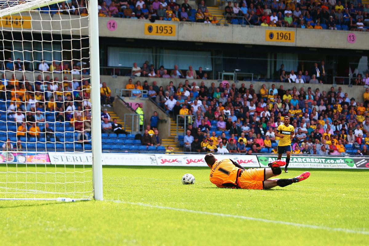 Pictures from United's 1-0 defeated at home to Burton Albion on the first day of the 2014 football season.