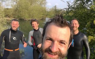 Kit Yates open-water swimming with a group on the River Thames