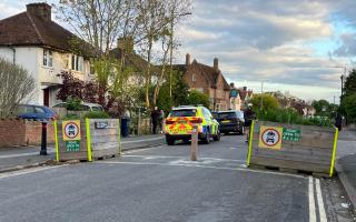 Police descend on residential road
