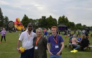 Football club chairman Richard Eltham with event organisers Laura Lynch and Jake Ramshaw