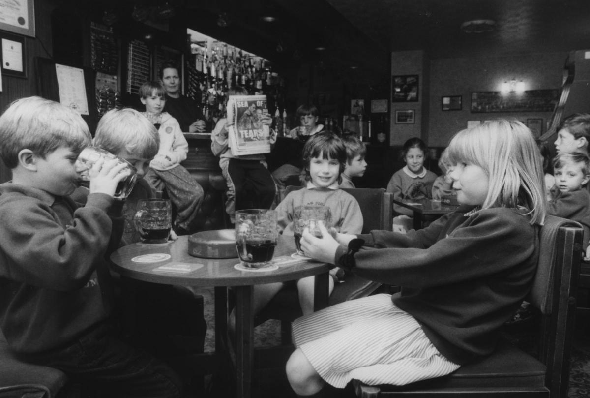 Youngsters pretend to enjoy a pint at the Jack Russell in Marston.