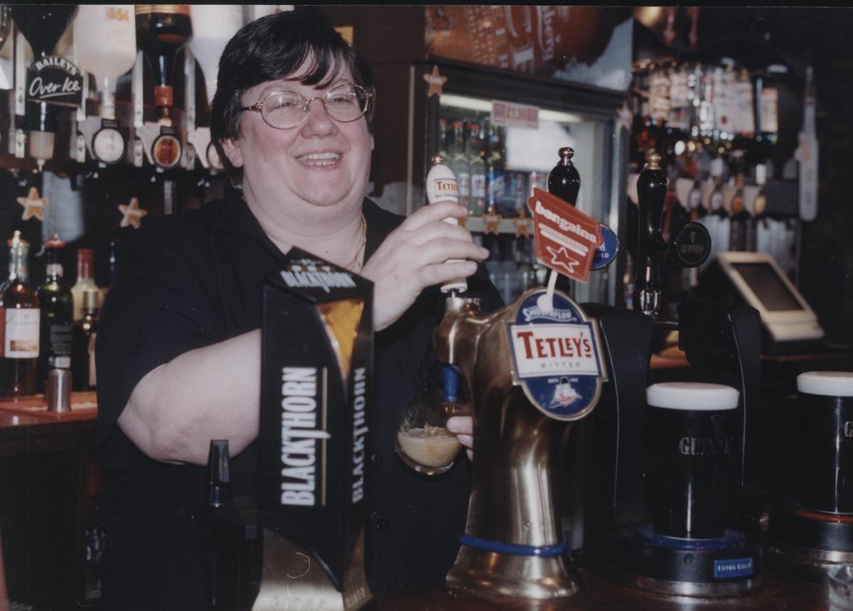 The Nelson's landlady Liz Bye pulls a pint in 2001.