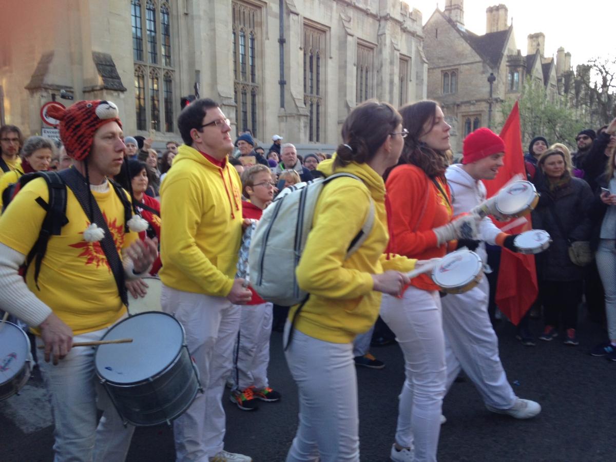 A samba street band makes its way into High Street.