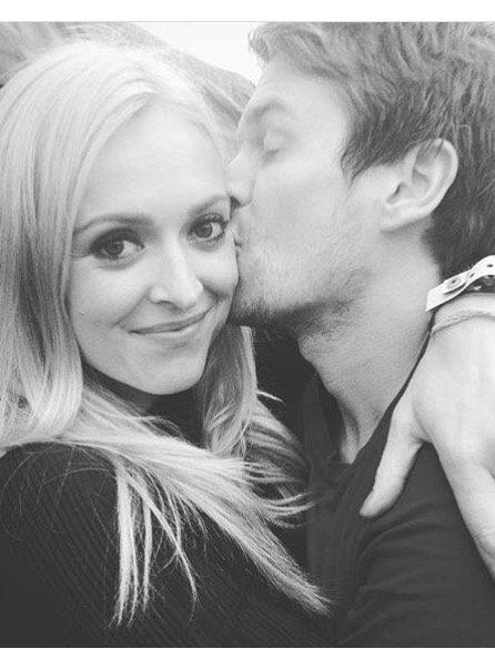 Fearne Cotton's husband, Jesse Wood, plants a kiss of her cheek at the Big Feastival. Fearne admitted on Twitter that she hasn't been getting much sleep as 11-month-old daughter Honey Krissy is teething. Picture: Twitter