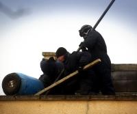 Bailiffs free the campaigner from a concrete-filled barrel