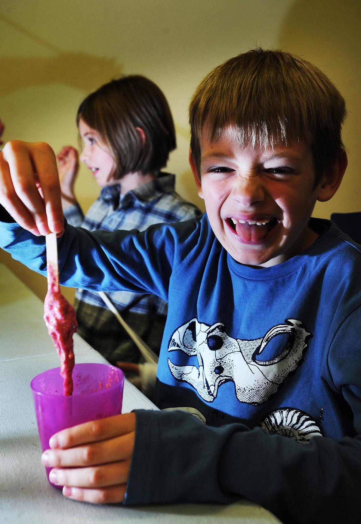 Maisie and Alfie Moore, aged eight and seven, enjoy a slime-making class at the Story Museum