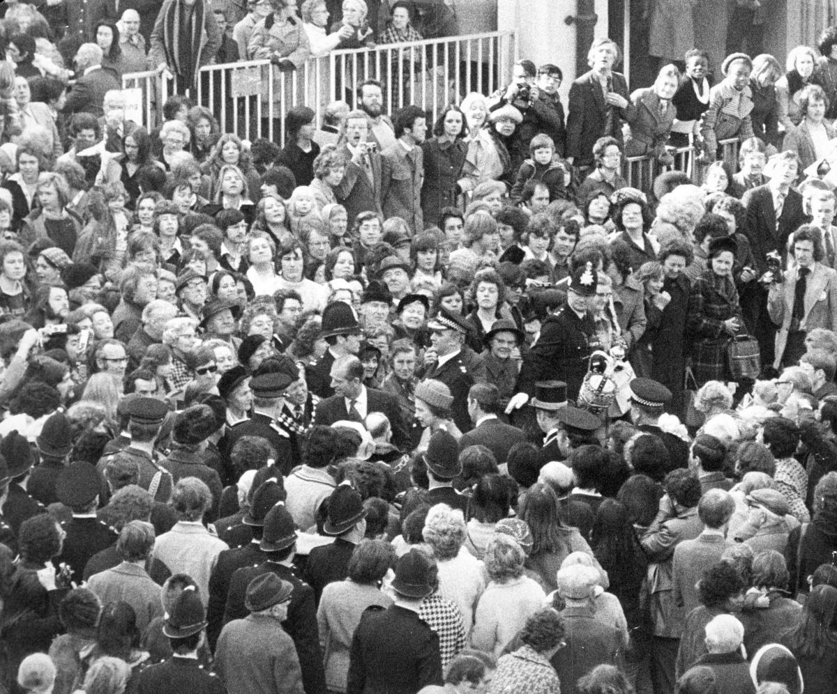 The Queen is greeted by crowds in Bonn Square during a visit to Oxford in 1976.