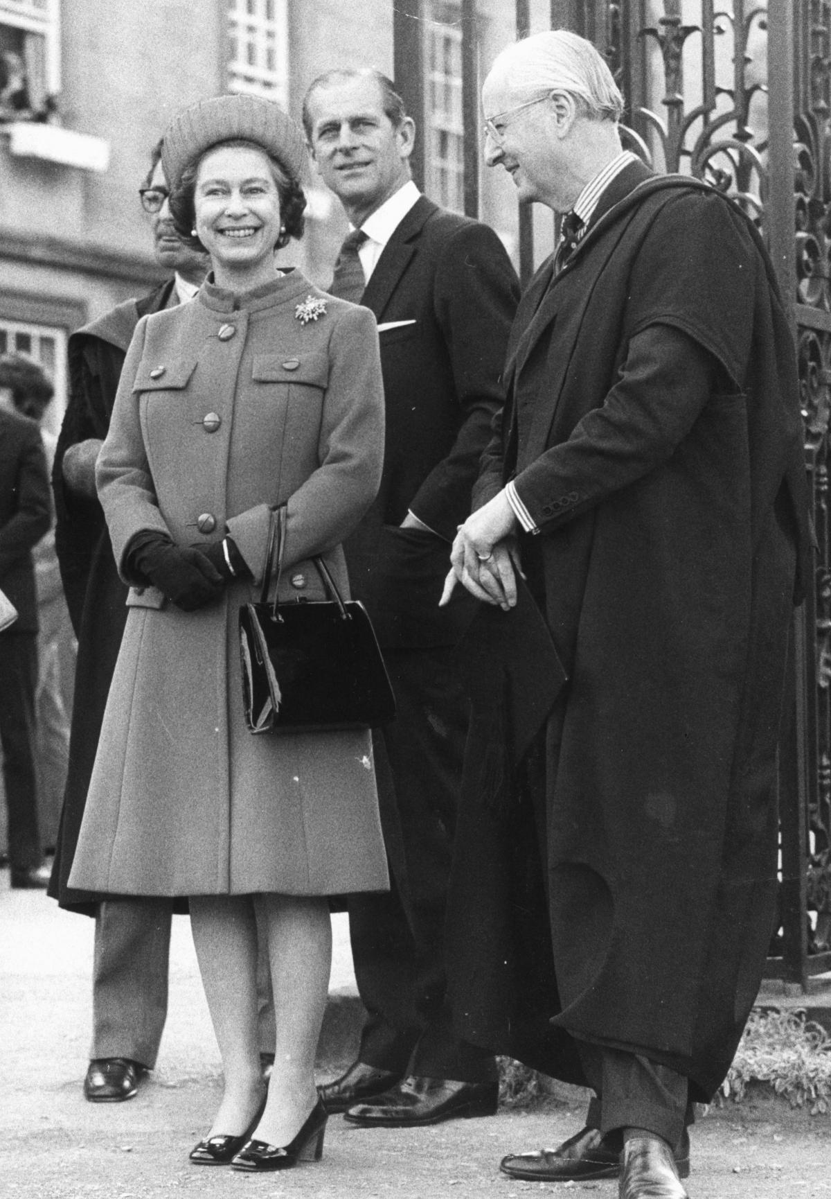 The Queen and The Duke of Edinburgh being shown New College gardens by the warden, Sir William Hayter, on May 2, 1968.