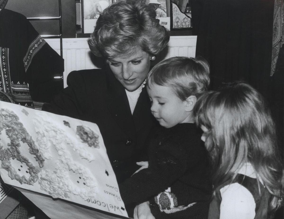 Princess Diana is presented a card by Sonia Scannell Williams and Tom Dammers in February 1990.