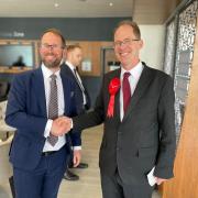 Re-elected Conservative PCC Matthew Barber (L) shakes hands with Labour rival Tim Starkey (R)