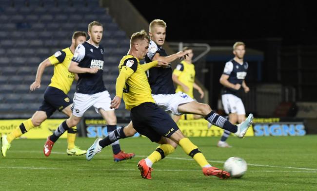 Mark Sykes scores for Oxford United against Millwall in the second round against Millwall last night  Picture: David Fleming