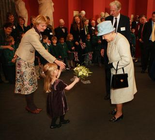 Grace Ford Clough, four, with mum Katherine Ford, presents a posy to the Queen when she visited the Ashmolean