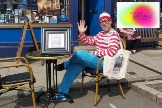 Blackwell’s Bookshop sales manager David Kelly uses the store’s new outdoor seating while taking a break from his shift as Where’s Wally