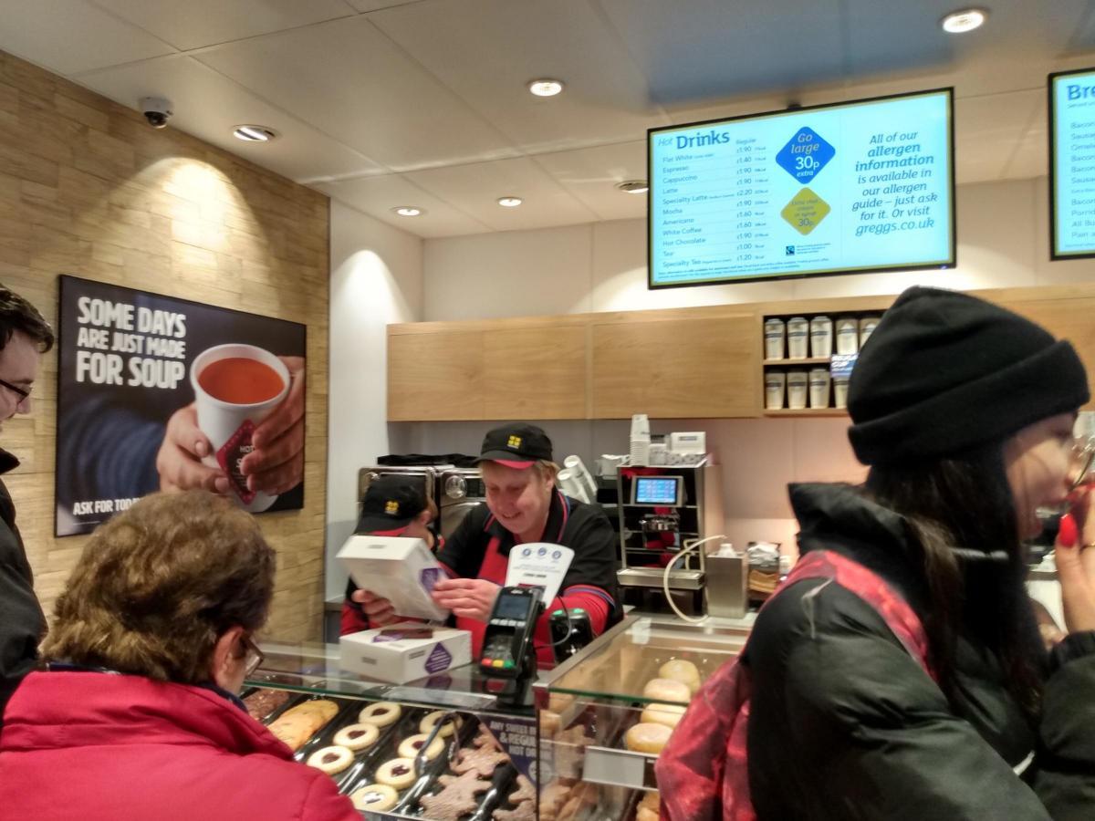 Customers queue up to be served 