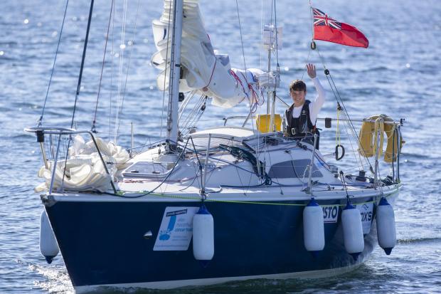 Oxford Mail: Oxford schoolboy Timothy Long, 15, is today set to become the youngest person ever to sail solo around the entire coast of Britain. The St Edward’s School pupil, pictured arriving in Largs in Scotland, is due to complete his mission this morning. Picture: Marc Turner