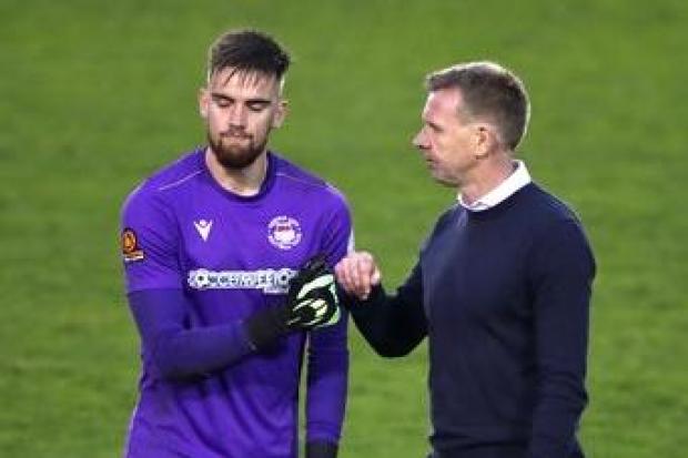Oxford City manager David Oldfield consoles goalkeeper Ben Dudzinski after the Emirates FA Cup second round defeat at Shrewsbury Town Picture: Nick Potts/PA Wire