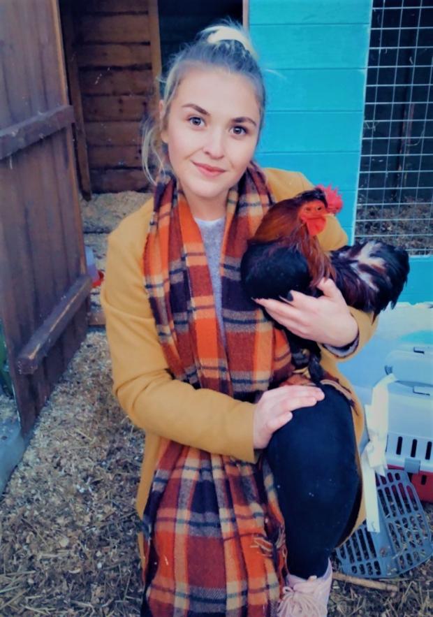 Oxford Mail: Sarah Jones with rescued rooster