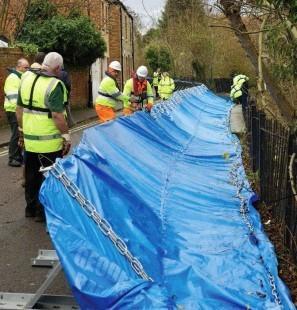 Statt from the Oxford Flood Alleviation Scheme test a flood barrier 
