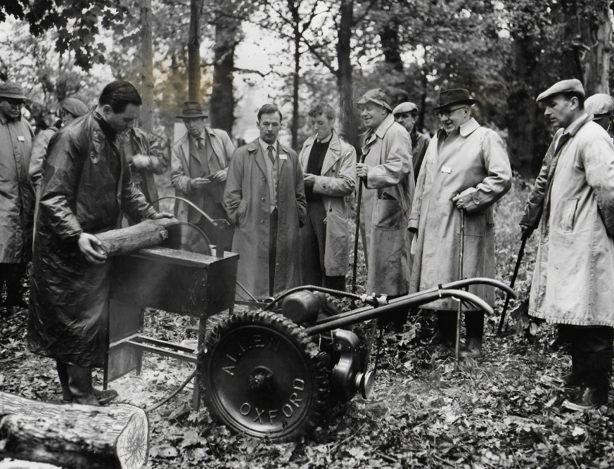 A scythe being shown to potential buyers in 1958