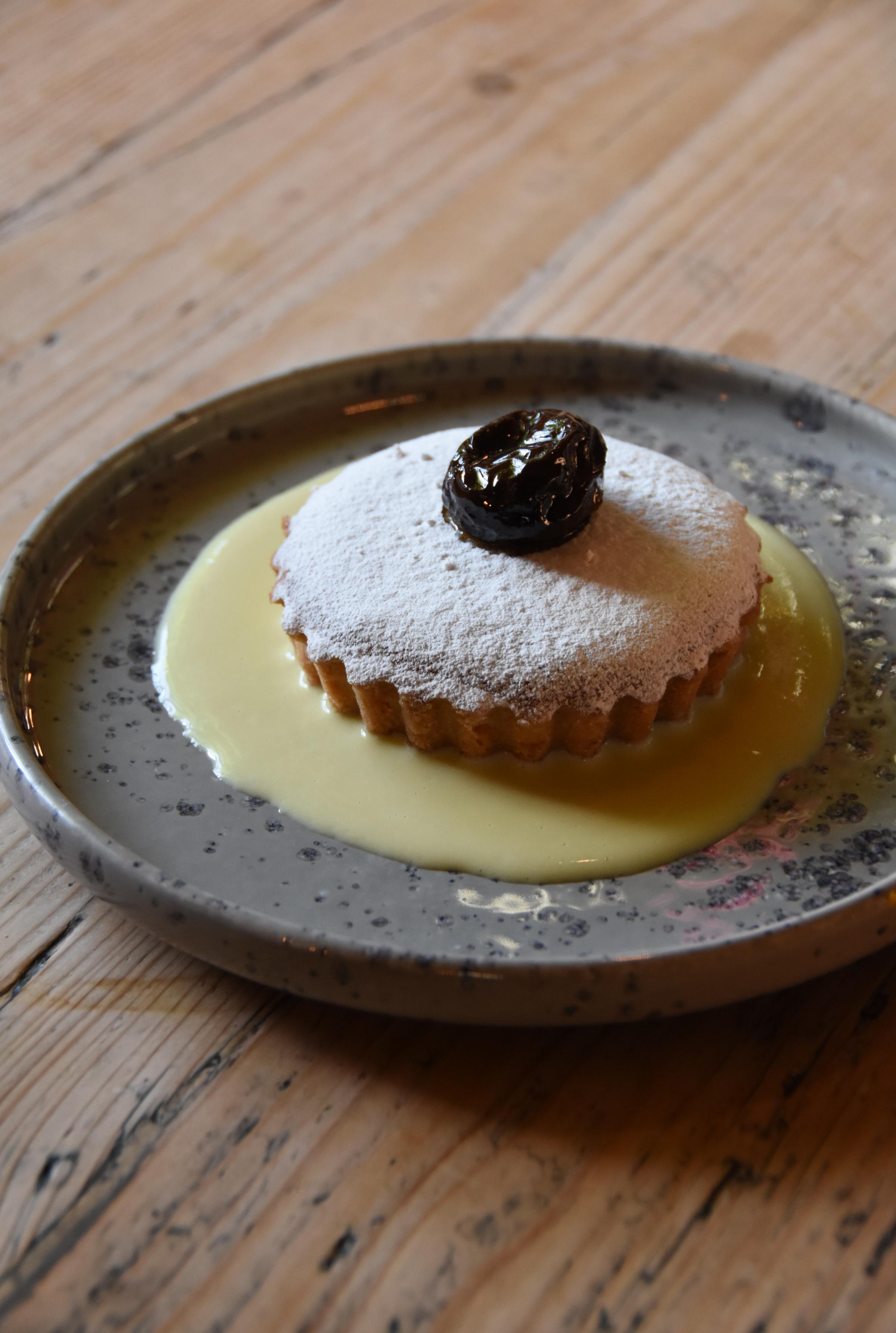Prune and almond tartlet with crème Anglaise