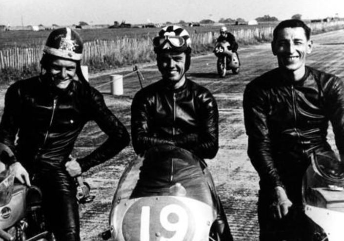 At Silverstone in 1959, left to right, Mike Hailwood, Irish rider Tommy Robb and mechanic Jim Adams