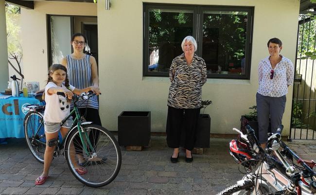 The 200th key worker receives a bike - pictured from right to left: JR Neurology ITU keyworker Agnes and niece Emily, bike donor Judy, and volunteer mechanic Sara