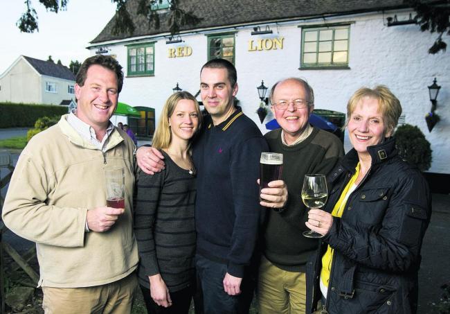 Dave Shelton, second right and the team running the community-owned Red Lion pub in Northmoor