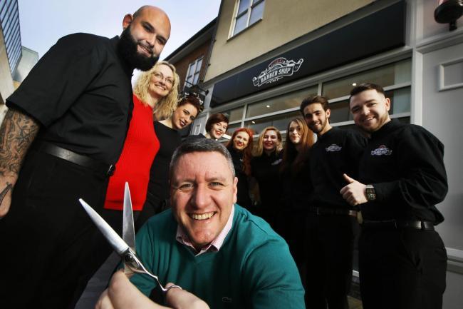 Andy Willis outside his barbers in Bicester