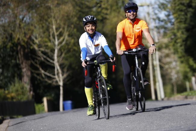 10-year-old Rishaan Chari cycles from Iffley to Blenheim Palace with his dad Raj Chari to raise money for Children in Need. Picture: Ed Nix